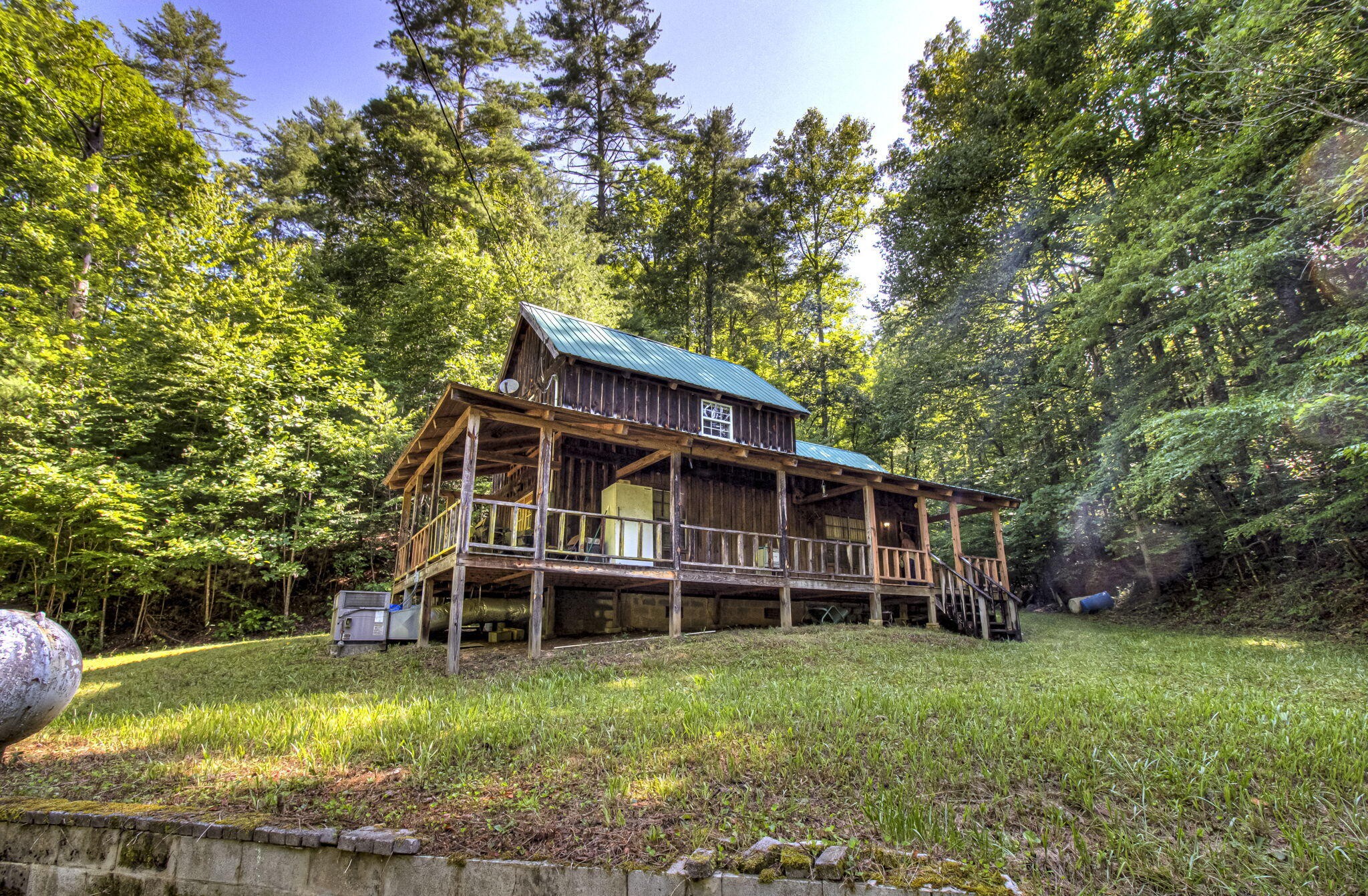 230 Big Towee Road Reliance, TN 37369 - Photo 59 of 69 a front view of a house with a garden and trees