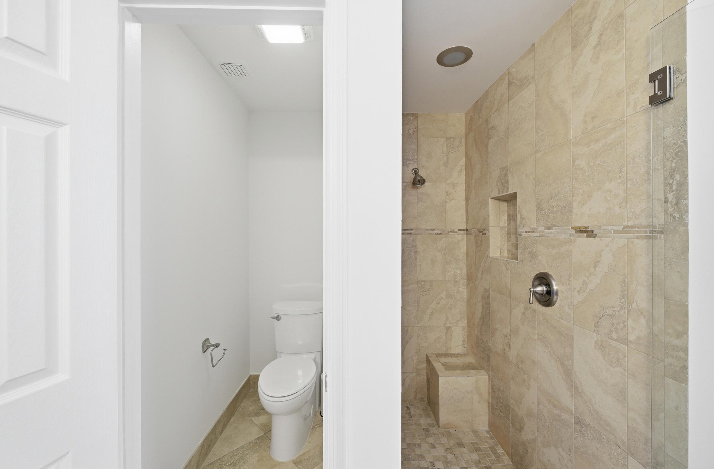 8534 Vía D Oro Boca Raton, FL 33433 - Photo 26 of 34 a bathroom with a toilet and a shower