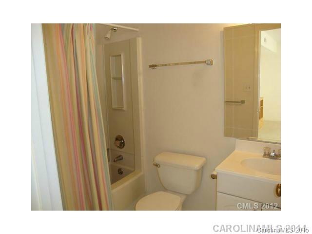 11103 Harrowfield Road Charlotte, NC 28226 - Photo 2 of 9 a bathroom with a sink a toilet and shower