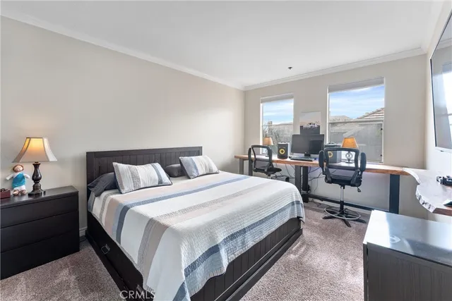 a bedroom with bed chair and window