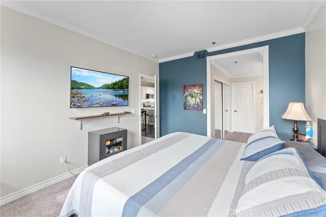 a bedroom with a bed and a fireplace