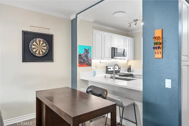 a kitchen with a table and chairs in it