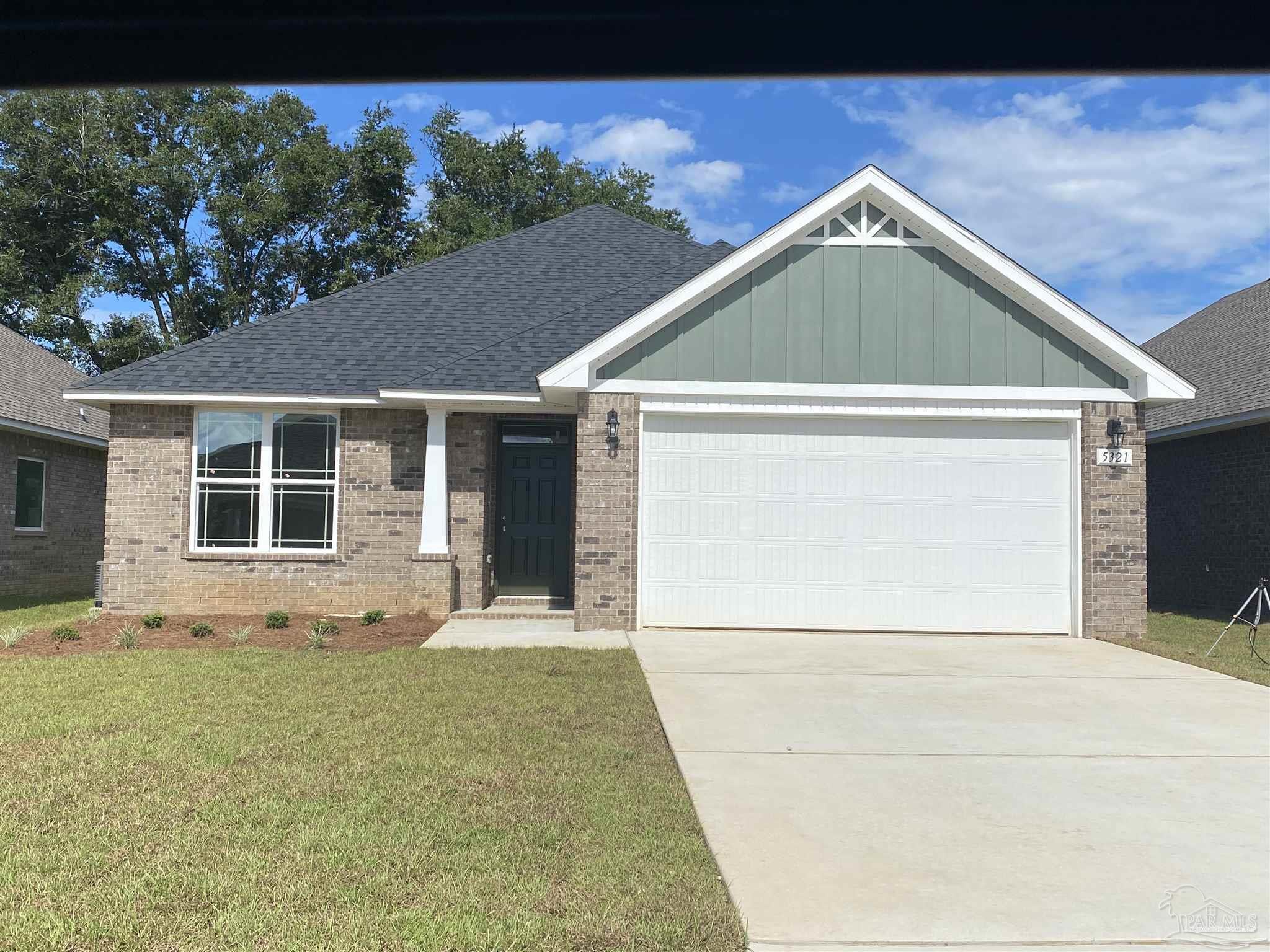 3877 Ranch Road Pace, FL 32571 - Photo 1 of 1 a front view of a house with a yard