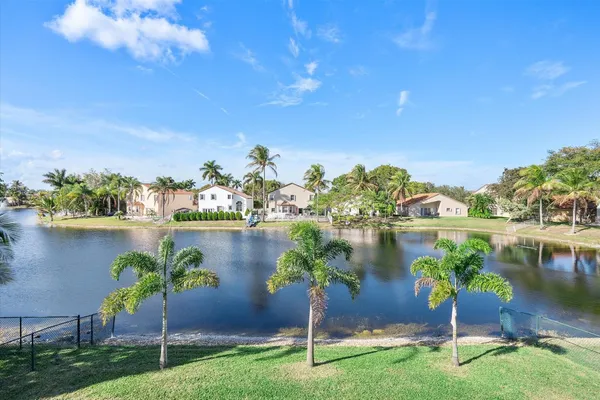 a view of a lake with a big yard