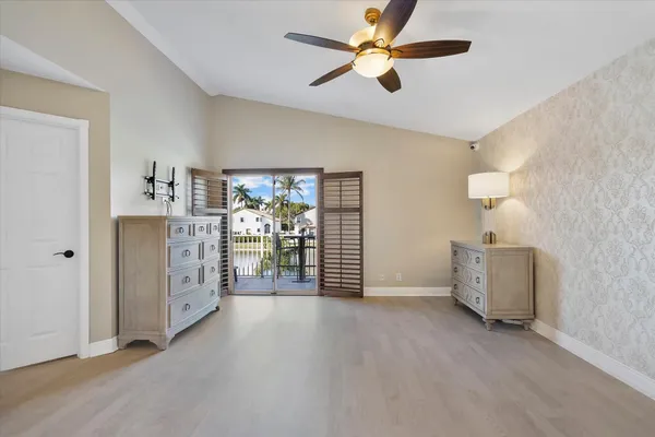 a view of a livingroom with furniture and an fan