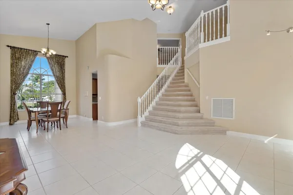 a workspace with wooden floor and windows