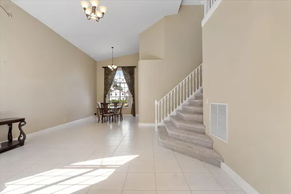 a view of entryway and hall with dining room