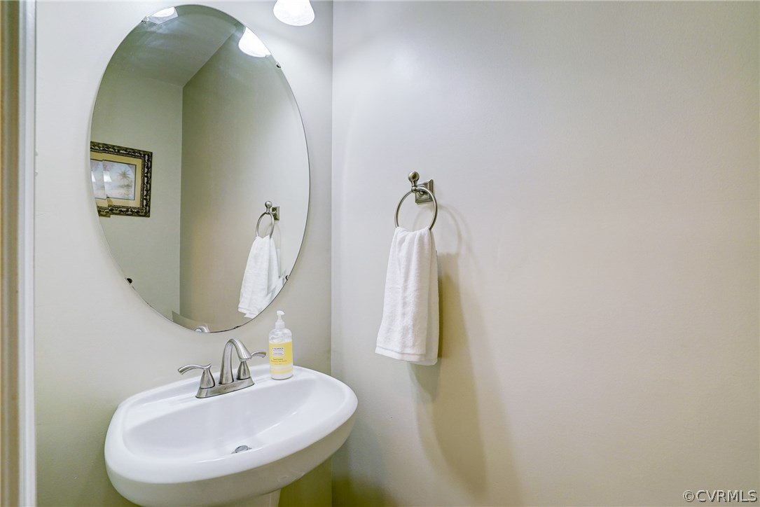 4240 Gayle Road Chester, VA 23831 - Photo 21 of 39 a bathroom with a sink and a mirror