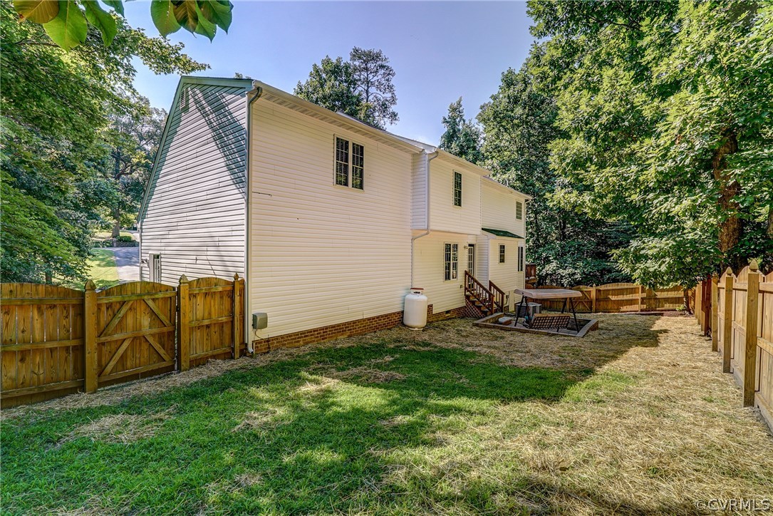 4240 Gayle Road Chester, VA 23831 - Photo 36 of 39 a view of a backyard with a sitting area