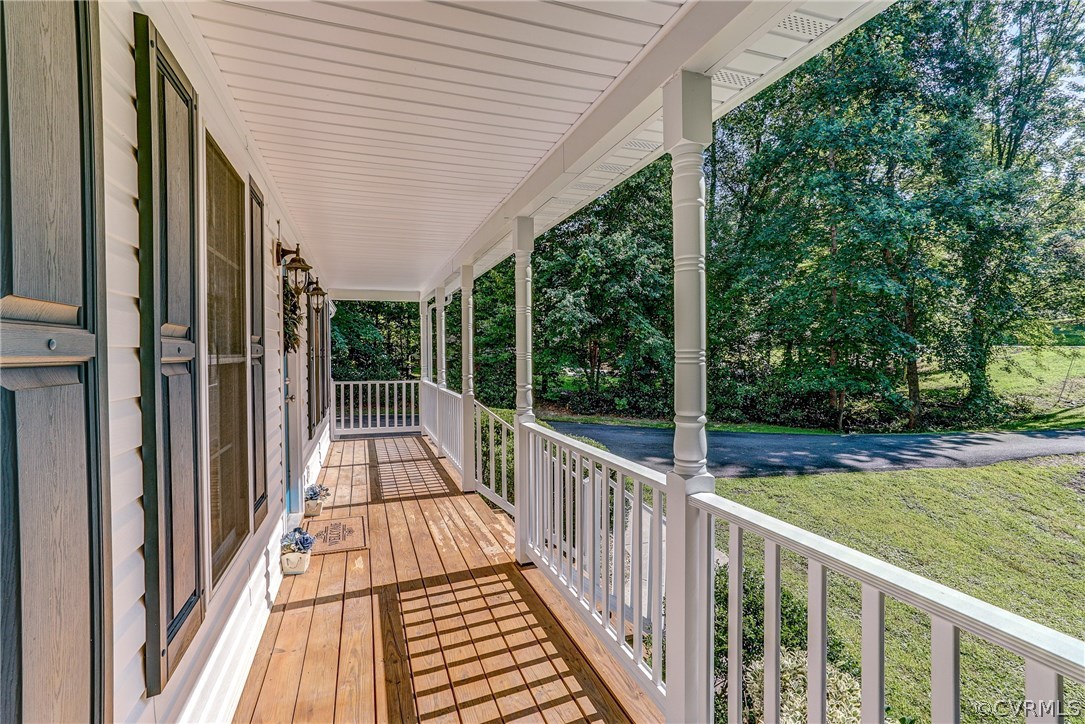 4240 Gayle Road Chester, VA 23831 - Photo 8 of 39 a view of balcony with wooden floor and fence