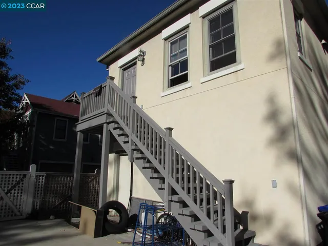 a view of a house with entryway and wooden floor