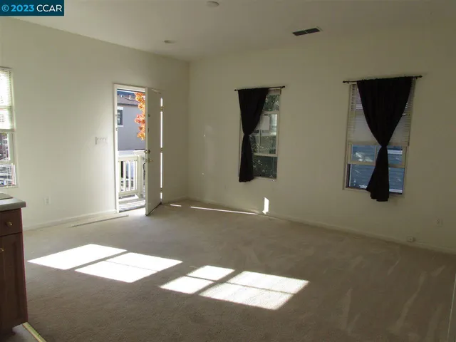 a view of empty room with windows