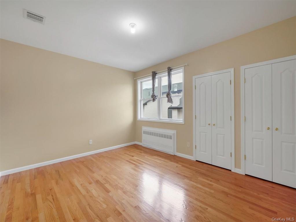 480 West Central Avenue Spring Valley, NY 10977 - Photo 18 of 35 wooden floor in an empty room with a window