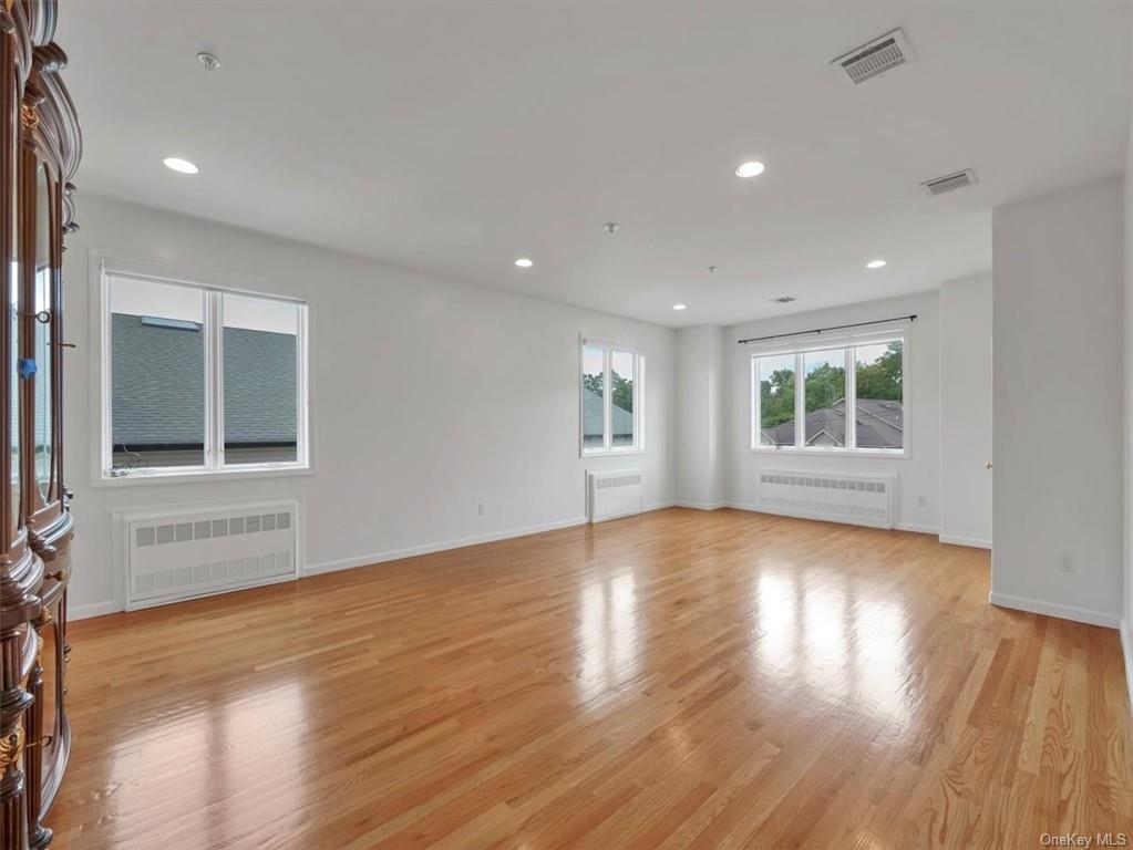 480 West Central Avenue Spring Valley, NY 10977 - Photo 2 of 35 a view of an empty room with wooden floor and a window