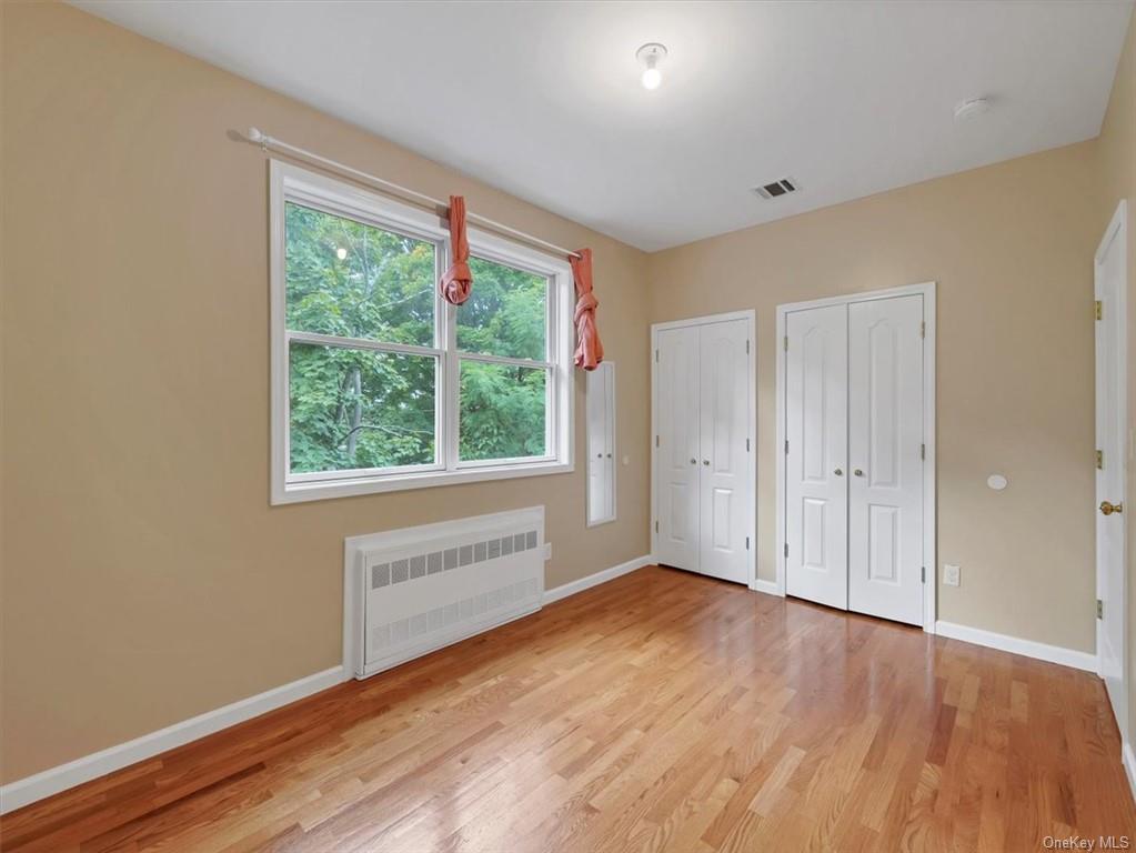 480 West Central Avenue Spring Valley, NY 10977 - Photo 21 of 35 a view of an empty room with wooden floor and a window