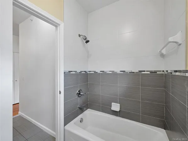 a bathroom with a shower and a bathtub