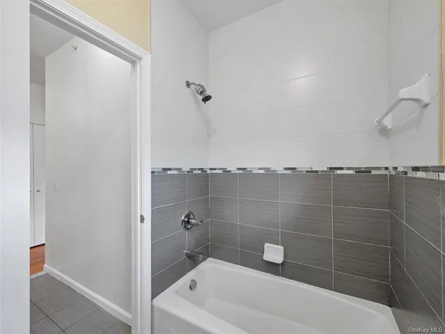 a bathroom with a shower and a bathtub