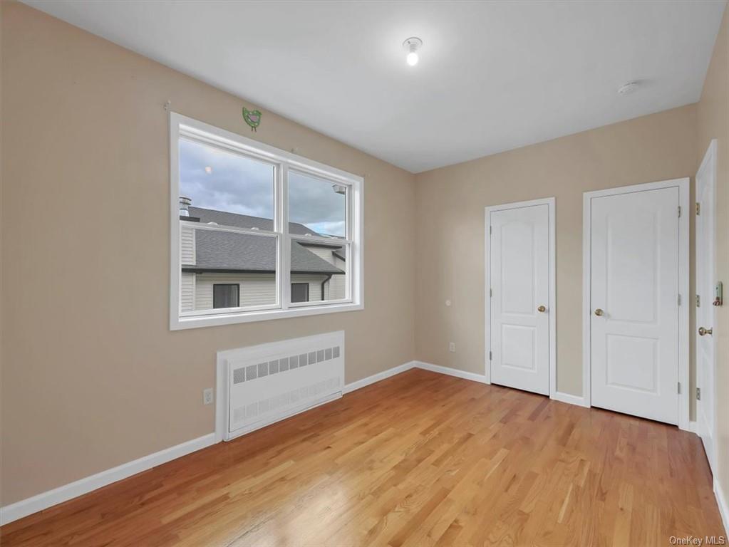 480 West Central Avenue Spring Valley, NY 10977 - Photo 25 of 35 a view of an empty room with wooden floor and a window