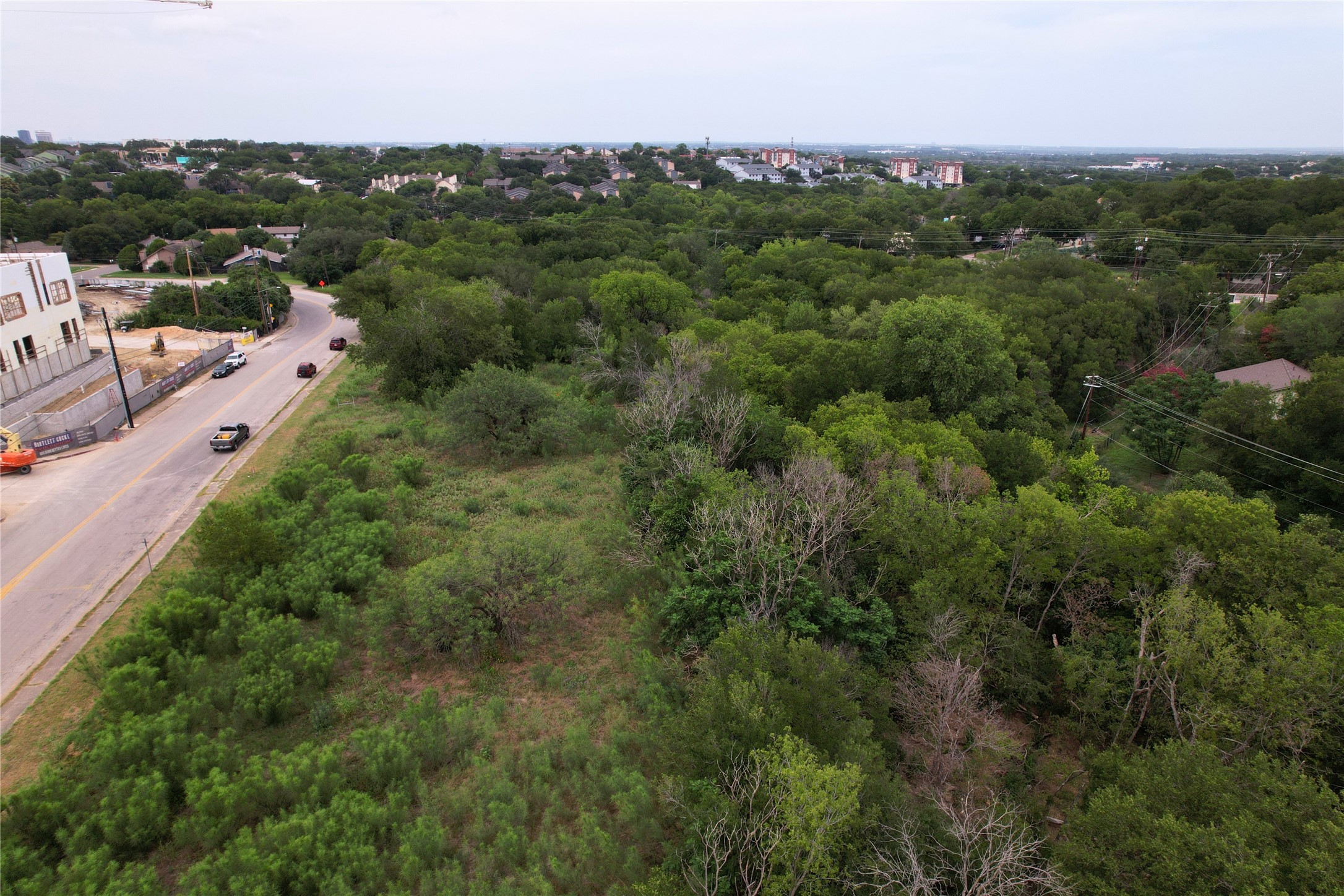 2819 Metcalfe Road Austin, TX 78741 - Photo 4 of 6 a view of a city with lush green forest