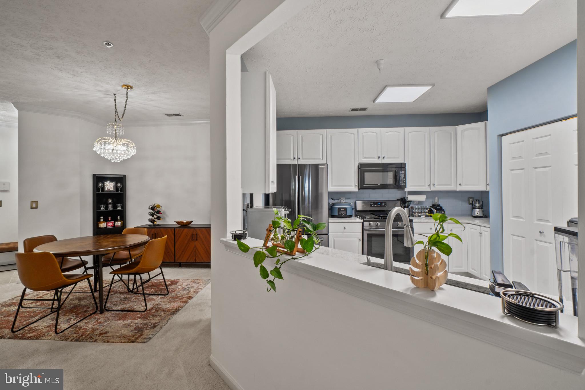 5144 Brightleaf Court, Unit 5144 Rosedale, MD 21237 - Photo 13 of 35 Modern kitchen with open layout charm.