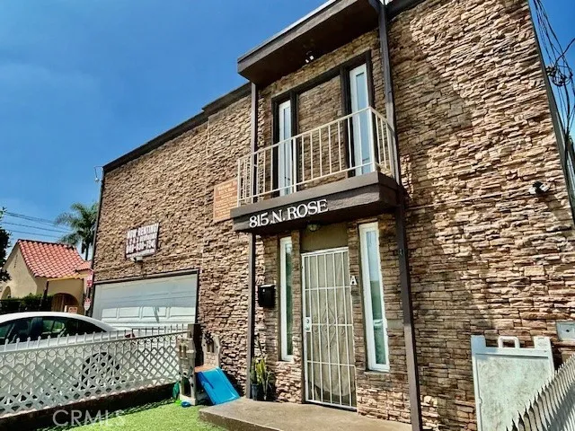 a front view of a house with garage