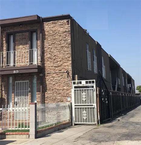 a view of a brick building with many windows