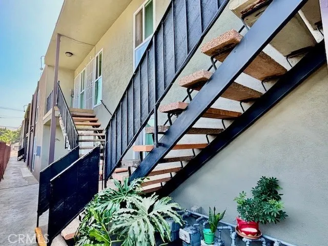 a view of entryway with wooden floor and a front door