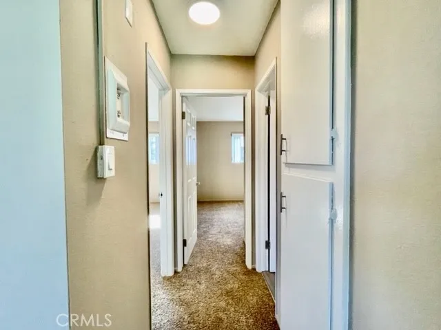 a view of a bathroom from a hallway