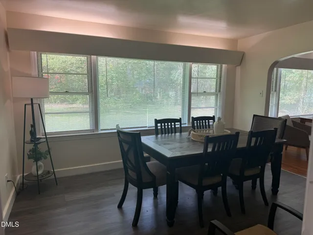 a view of a dining room with furniture and window
