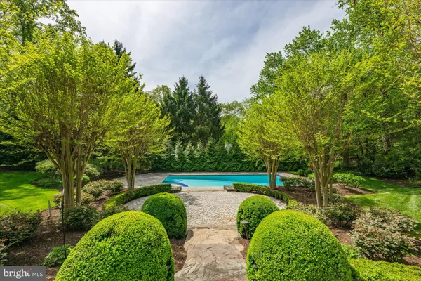 a view of green field with sitting area