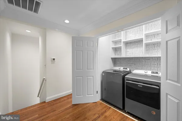 a kitchen with a stove and a refrigerator