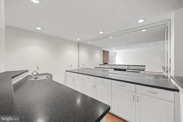 a large kitchen with a lot of counter space and a sink