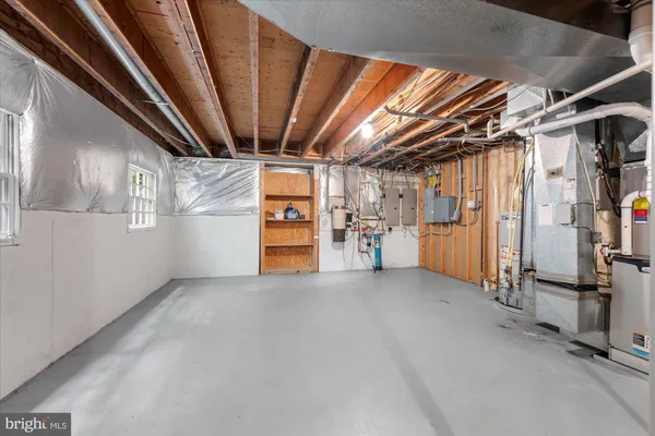 a view of empty room with wooden walls