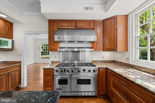 a kitchen with a stove and a sink