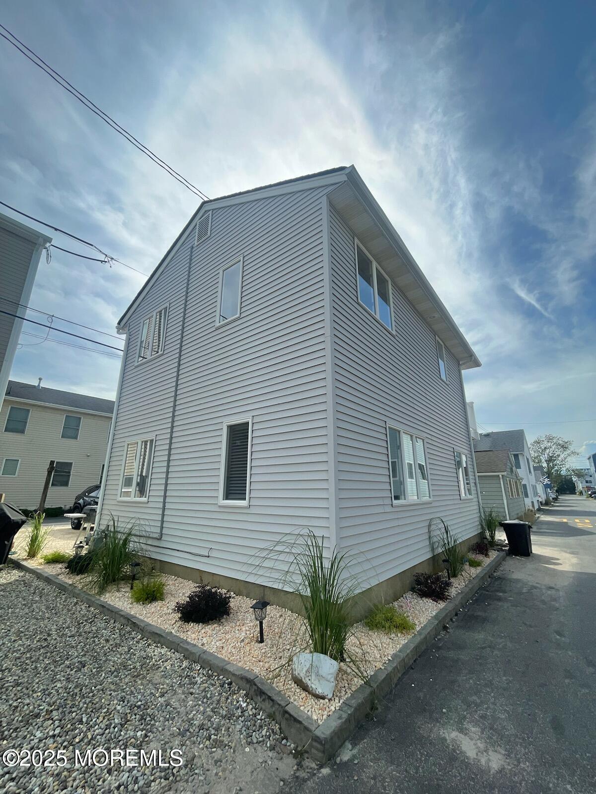 23 Surf Way Lavallette, NJ 08735 - Photo 2 of 26 a backyard of a house