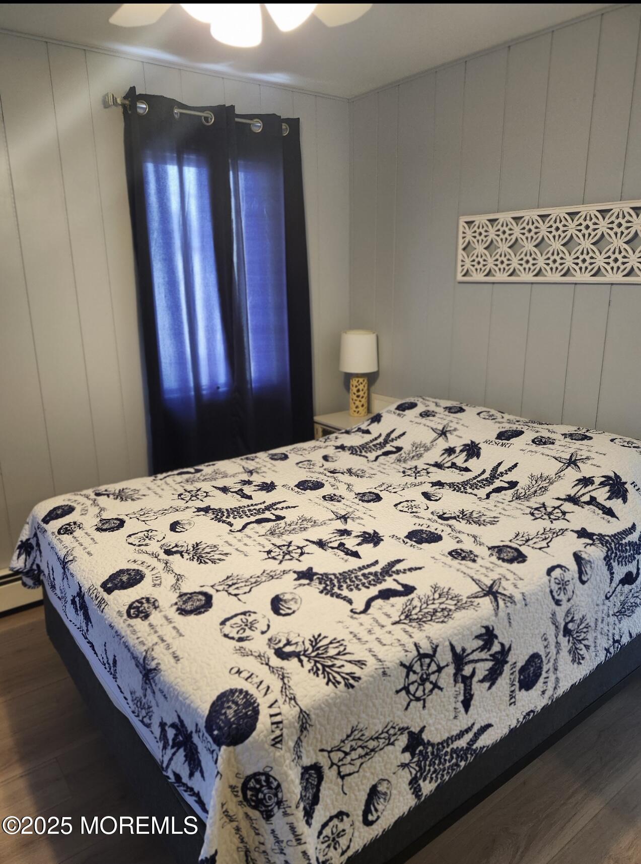 23 Surf Way Lavallette, NJ 08735 - Photo 21 of 26 a bedroom with a bed and a window