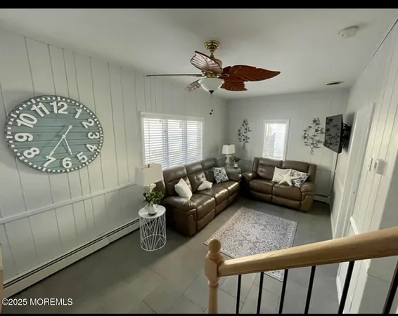 a living room with furniture and a rug