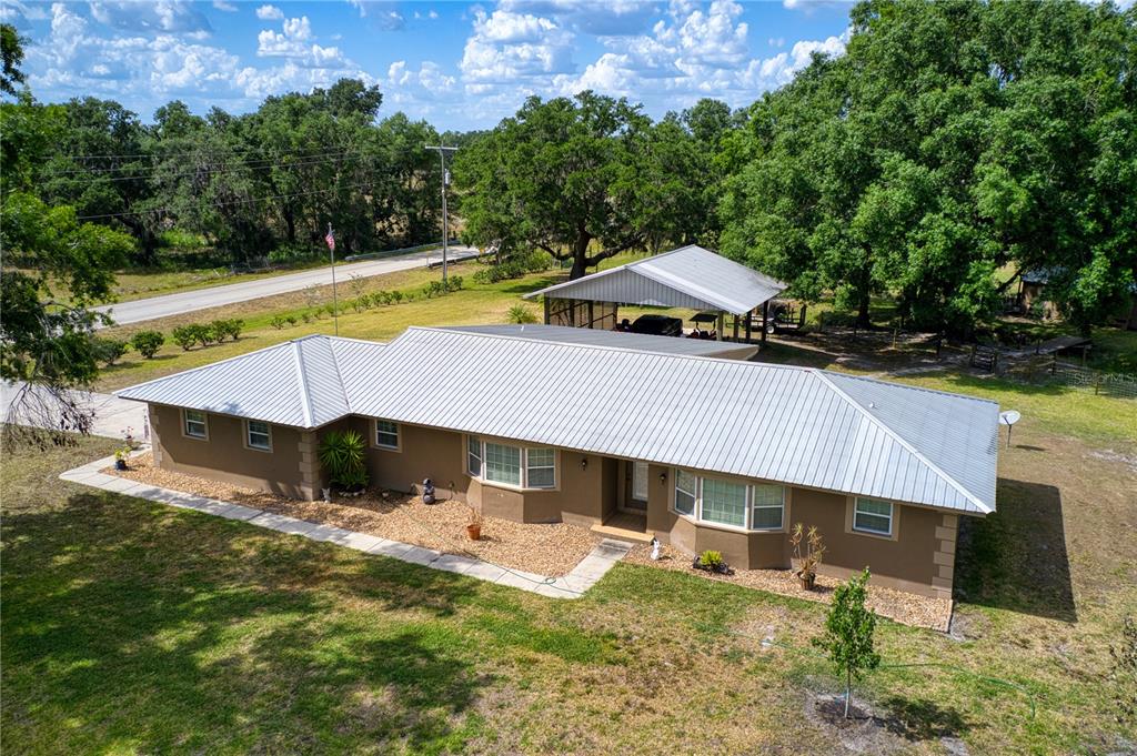 102 Boyd Cowart Road Wauchula, FL 33873 - Photo 1 of 1 a view of a house with swimming pool and sitting area