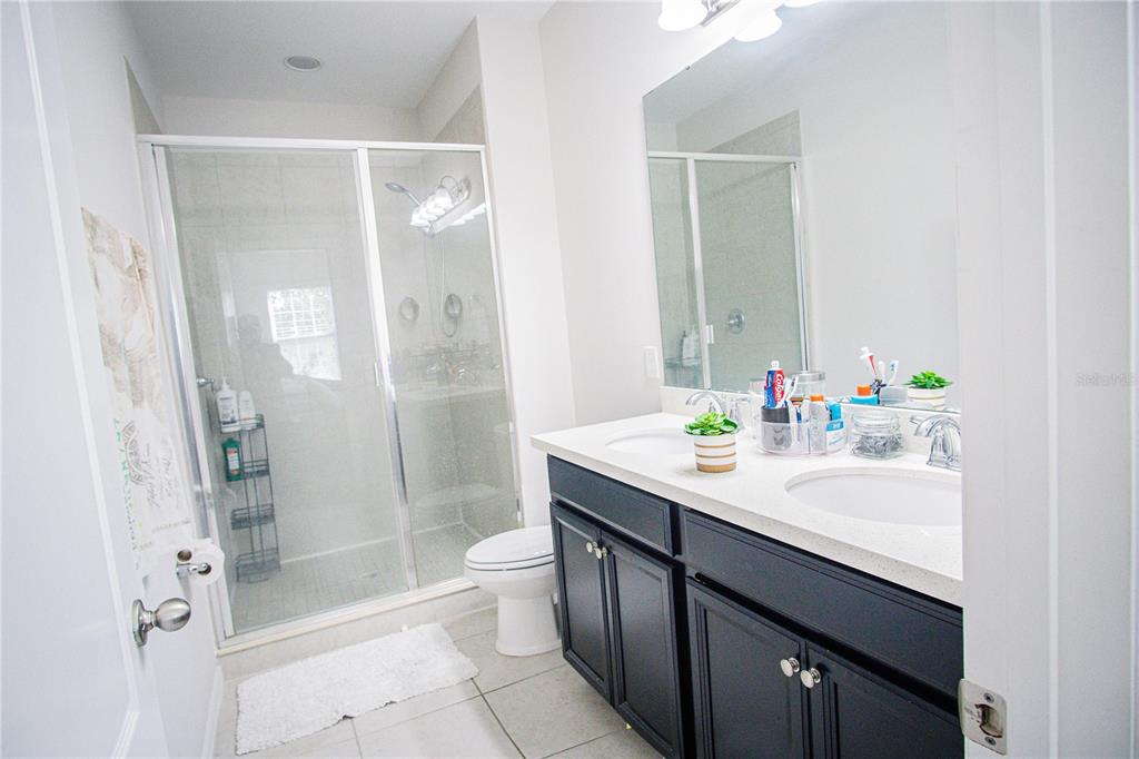 11636 Water Run Alley Windermere, FL 34786 - Photo 14 of 18 a bathroom with a sink and a mirror