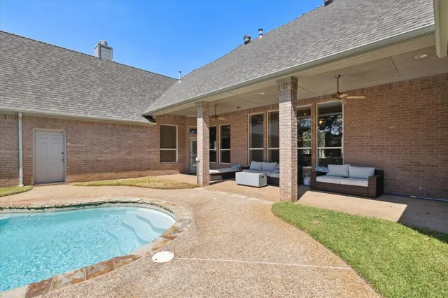 a swimming pool with outdoor seating