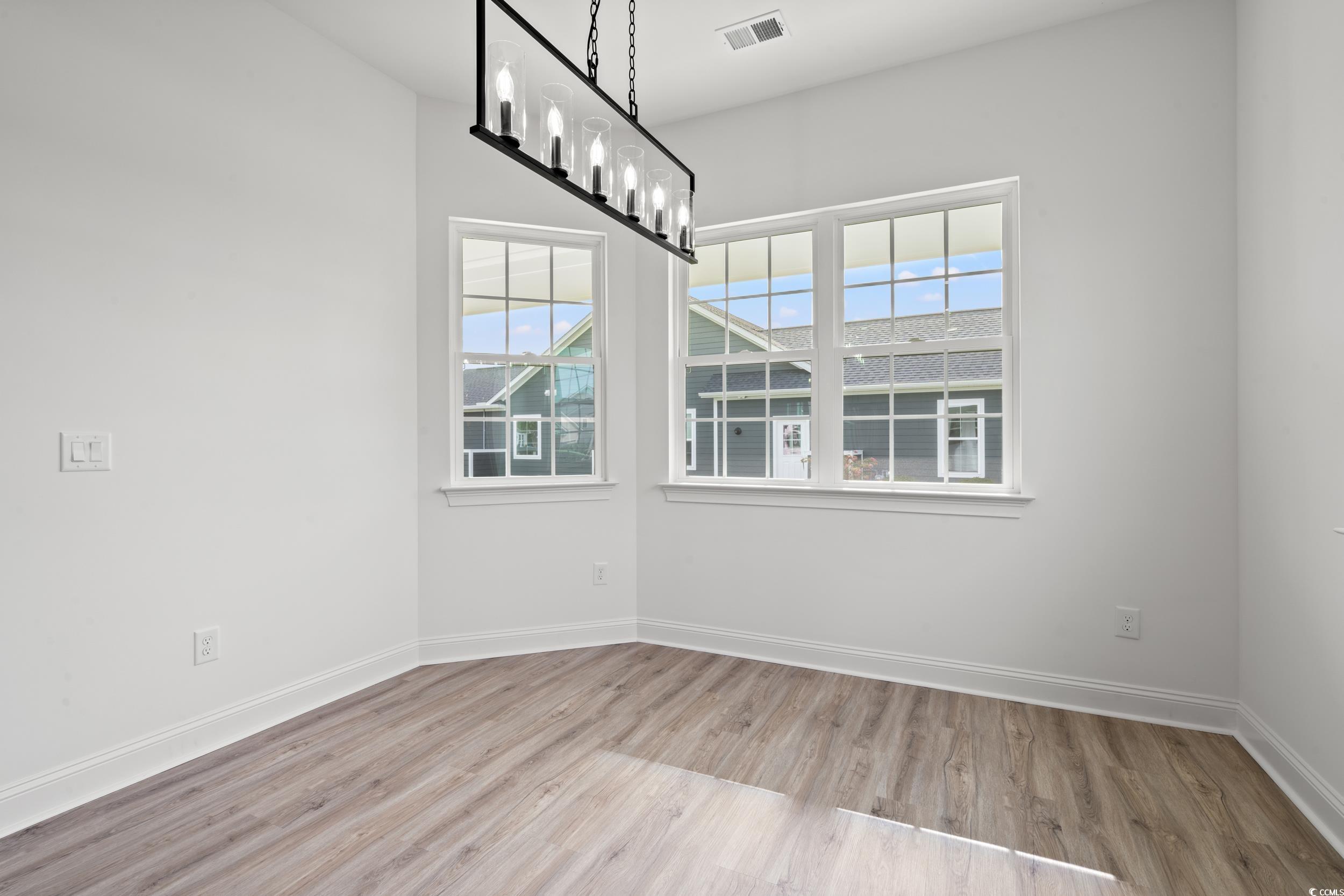 1009 Englemann Oak Drive Myrtle Beach, SC 29579 - Photo 11 of 38 Unfurnished dining area with healthy amount of natural light and light wood-type flooring