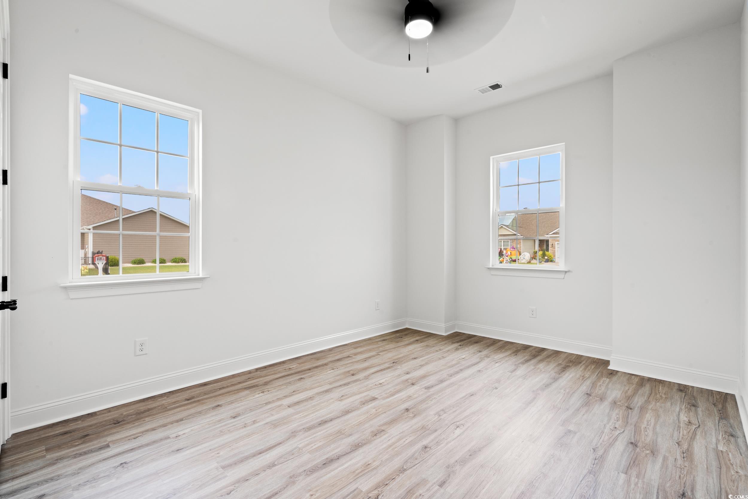 1009 Englemann Oak Drive Myrtle Beach, SC 29579 - Photo 21 of 38 Spare room with light wood-style flooring and ceiling fan