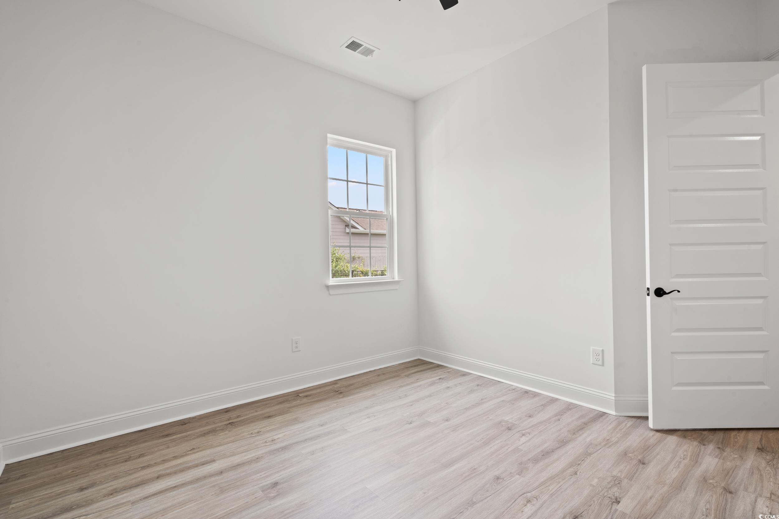 1009 Englemann Oak Drive Myrtle Beach, SC 29579 - Photo 27 of 38 Spare room with light wood finished floors and ceiling fan