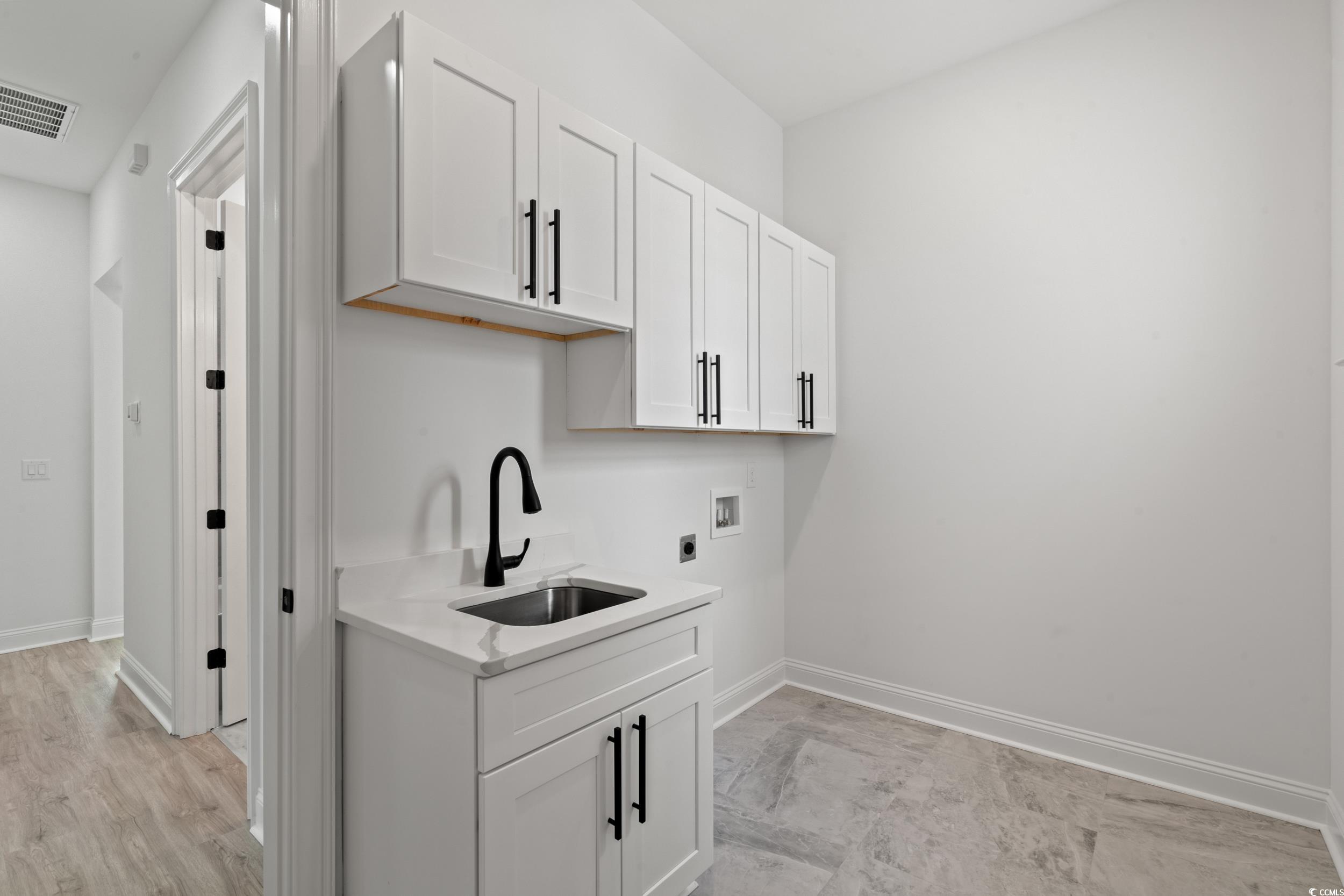 1009 Englemann Oak Drive Myrtle Beach, SC 29579 - Photo 31 of 38 Washroom featuring cabinet space and hookup for a washing machine