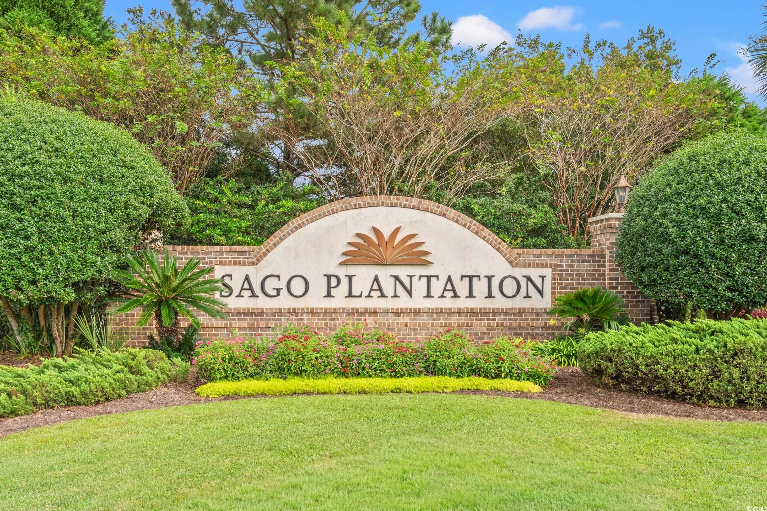 1009 Englemann Oak Drive Myrtle Beach, SC 29579 - Photo 37 of 38 Community sign with a lawn