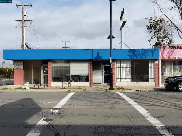 a outdoor view of a building with traffic signal lights