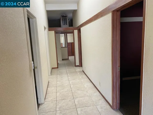 a view of entryway with a floor to ceiling window and stairs