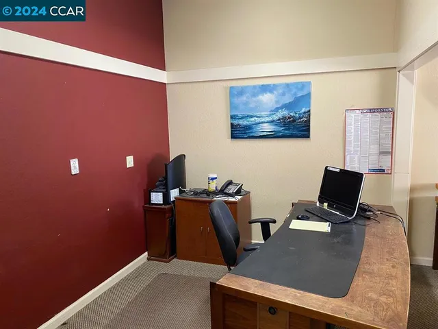 a view of a workspace with furniture