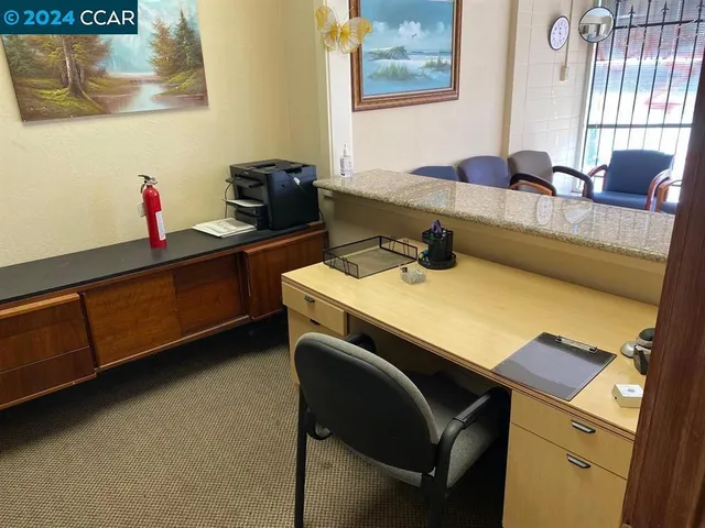 a kitchen with a sink cabinets and appliances