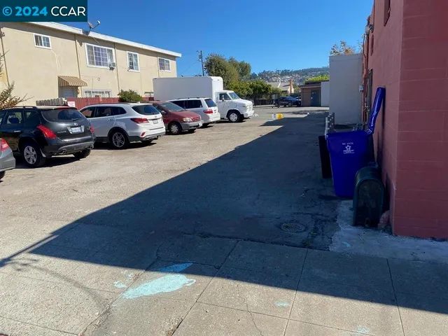 a view of street with parked cars